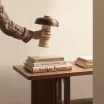 Audo Copenhagen Reverse Portable Table Lamp on Coffee Table