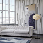 Le Klint Swirl Floor Lamp Beside Sofa