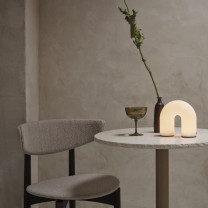 Vuelta LED Portable Lamp on side table