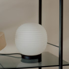 New Works Globe Lantern Table Lamp close up on shelf