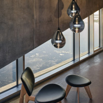 Tom Dixon Flare LED Pendant Light Lifestyle Chair 2