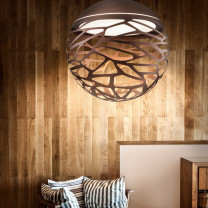 Lodes Kelly Sphere Pendant Copper Above Chair