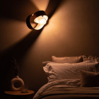 Tom Raffield Verso Wall Light Walnut Above Bed Lights Off